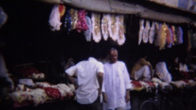 1972: Arab Flower Market Vendor in Colorful Karachi Bazaar