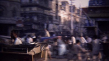 1972: Horse pulling cart busy urban arab commercial street.