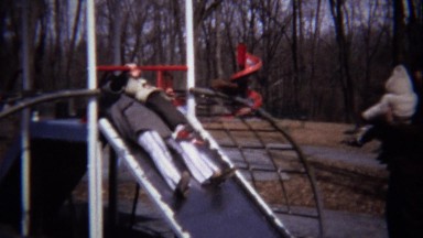 1973: Mom and Baby in Tandem Stroller at Snowy Playground in Zagreb