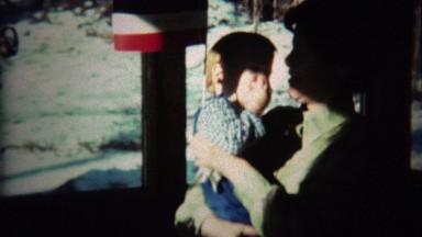1973: Mom and Baby Dance While Waving Yugoslavian National Flag