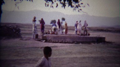 1973: Arab women water well primitive clay pot vessels.