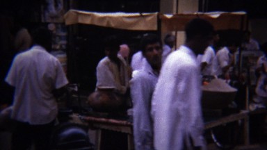 1973: Arab street food cooked rice vendor busy crowds.