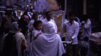 1973: People walking crowded arab shopping district street.
