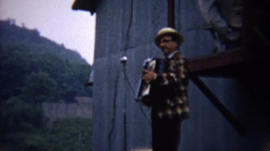 1962: Accordion music instrument man entertaining county fair.