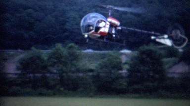 1962: Private helicopter landing country fair amusement park.