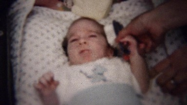 1958: Newborn Baby Being Brushed by Mom in Moline, Illinois