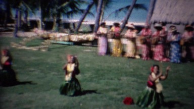 1961: Hawaiian Hula Dancers Kneeling in Colorful Native Stick Dance