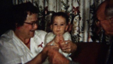 1958: Grandparents Entertaining Baby with Hand Signals and Forced Clapping