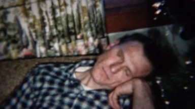 1959: Drunk dad sleeping after holiday meal embarrassingly hides face.