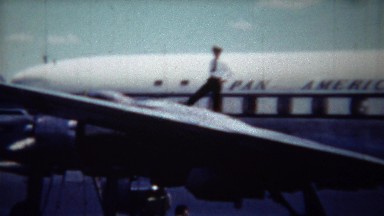 1954: Pilot Confidently Standing on Pan American Airlines Airplane