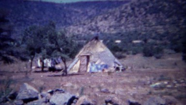 1963: Ratty Native American tee-pee hut made found materials.