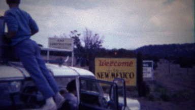 1963: New Mexico welcome sign family travel car breakdown.