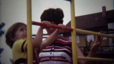 1974: Toddler Climbing Metal Playground Ladder Mom Supervises
