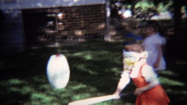 1974: Birthday Pinata Party Girl Swinging Baseball Bat Cracks Open