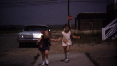 1974: Best Friend Girls Running Holding Hands Sunglasses Beach