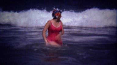 1974: Women survives big ocean waves points like told you so.
