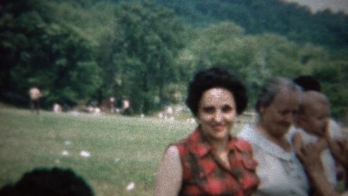 1963: Plaid Sleeveless Shirt Woman at Outdoor Family Reunion Picnic