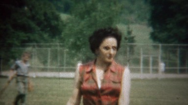 1963: Italian American Woman Walks Park in Plaid Sleeveless Shirt