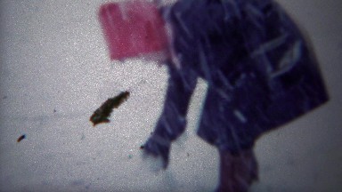 1954: Kid builds snowman winter storm blizzard whiteout conditions.