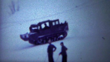 1956: Tank track vehicle uphill travel winter snow skiing resort.