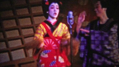 1956: Japanese Comedy Show Featuring Geisha and Man Dancing Silly