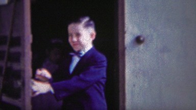 1954: Formal Suit Wearing Boy Leaves House Cute Face Closeup.