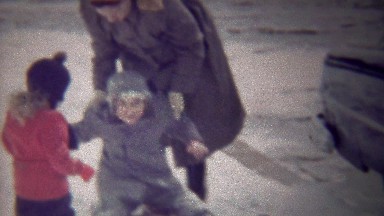 1954: Mom Loads Happy Kids on Sled in Winter Snow on Sidewalk