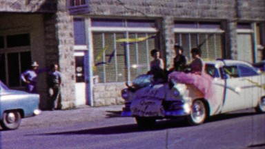 1958: Beauty Queens Riding Classic Car Hood Victory Parade