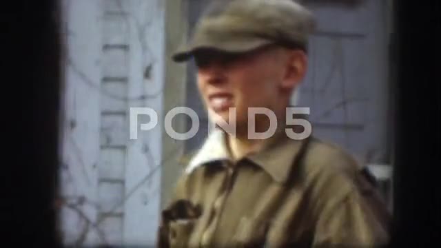 1958: Man and Woman Wrestling Outdoors with Choker Hold and Full Nelson