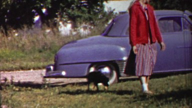 1958: Patriotic USA 4th of July women walking with bar door.