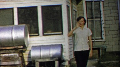 1958: Tough women brings knuckle sandwich punch to cameraman.