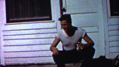 1958: Wild teenager smoking cigarette drinking beer calling dog.