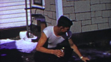 1958: Punk teenager smoking cigarette drinking beer petting dog.