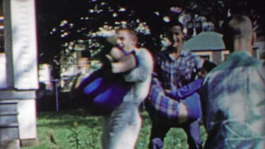 1958: Teenages carry girlfriends while old people pose for photo.