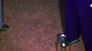 1963: Drop closepin bottle fun party game man closeup.