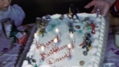 1964: Happy birthday David birthday cake candles kids party.