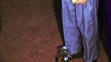 1963: Drop closepin bottle cheater puts hand too close in jeans.