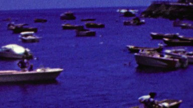 1962: Blue seas party motor boating harbor seaside port.