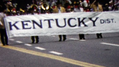 1960: Kentucky district 43 lions club parade sign marching group.