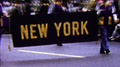 1960: New York state parade introduction sign marching band.