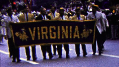 1960: Virginia state parade adult walking pride banner sign.