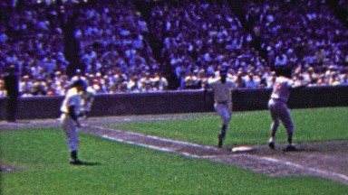 1963: Ernie Banks Hits First Base at Wrigley Field