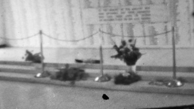 1964: Heroic flowers of a fallen soldier memorial remembrance site.