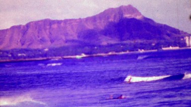 1964: Diamond Head volcano from blue ocean waters to sky.