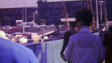 1964: Buyers inspecting boat harbor property rentals for sale.
