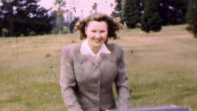 1957: Happy New Mother Pushes Baby Stroller in Cemetery