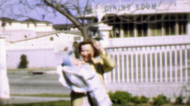 1957: Mother baby enjoying sunshine classic dining room supper club.