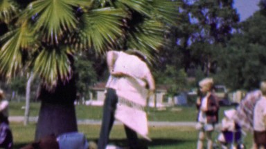 1957: Cross Dressing Adult Fun Charity Competition Race Outfit Swap.