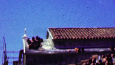 1957: Church under construction clay tile roof concrete materials.
