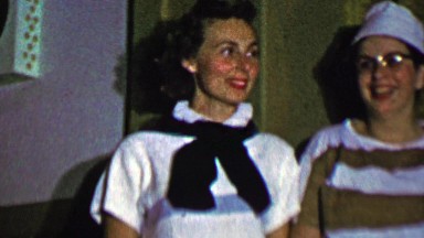1957: Women ready to take final bow after theatre musical performance.